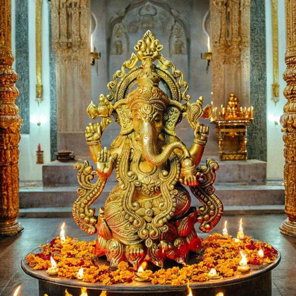 Brass Chaturbhuj Ganesha Idol sitting on Lotus base with Heavy Jewellery
