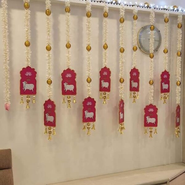Gajra with cow cut out hangings backdrop